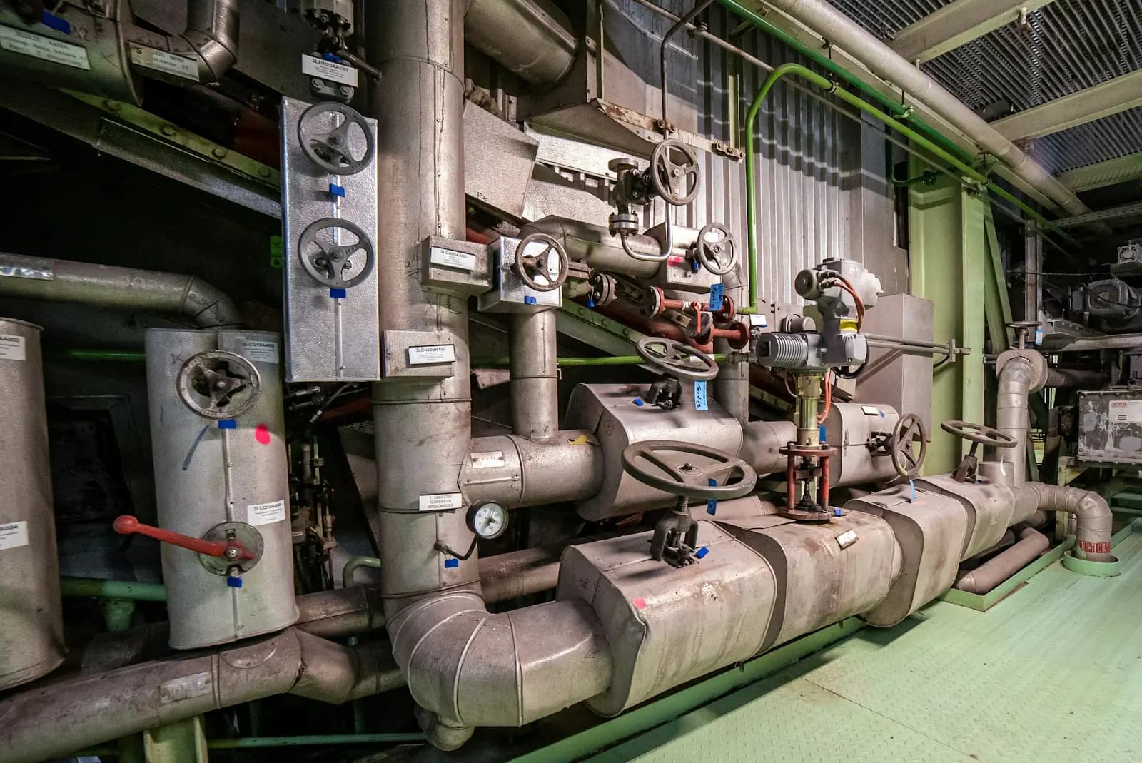 Valves and pipework in a building services plant room