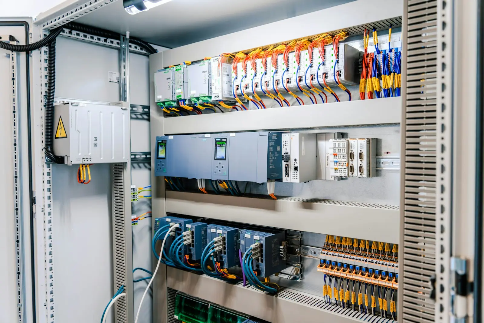 Control cabinet with variable frequency drives, servo drives and PLC modules