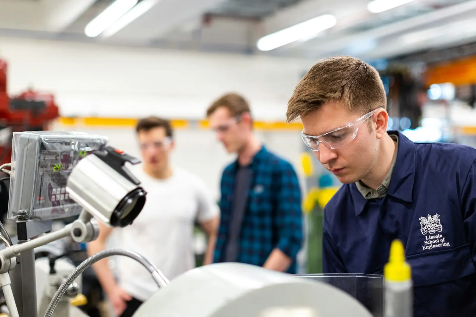 Engineers inspecting food and beverage processing equipment