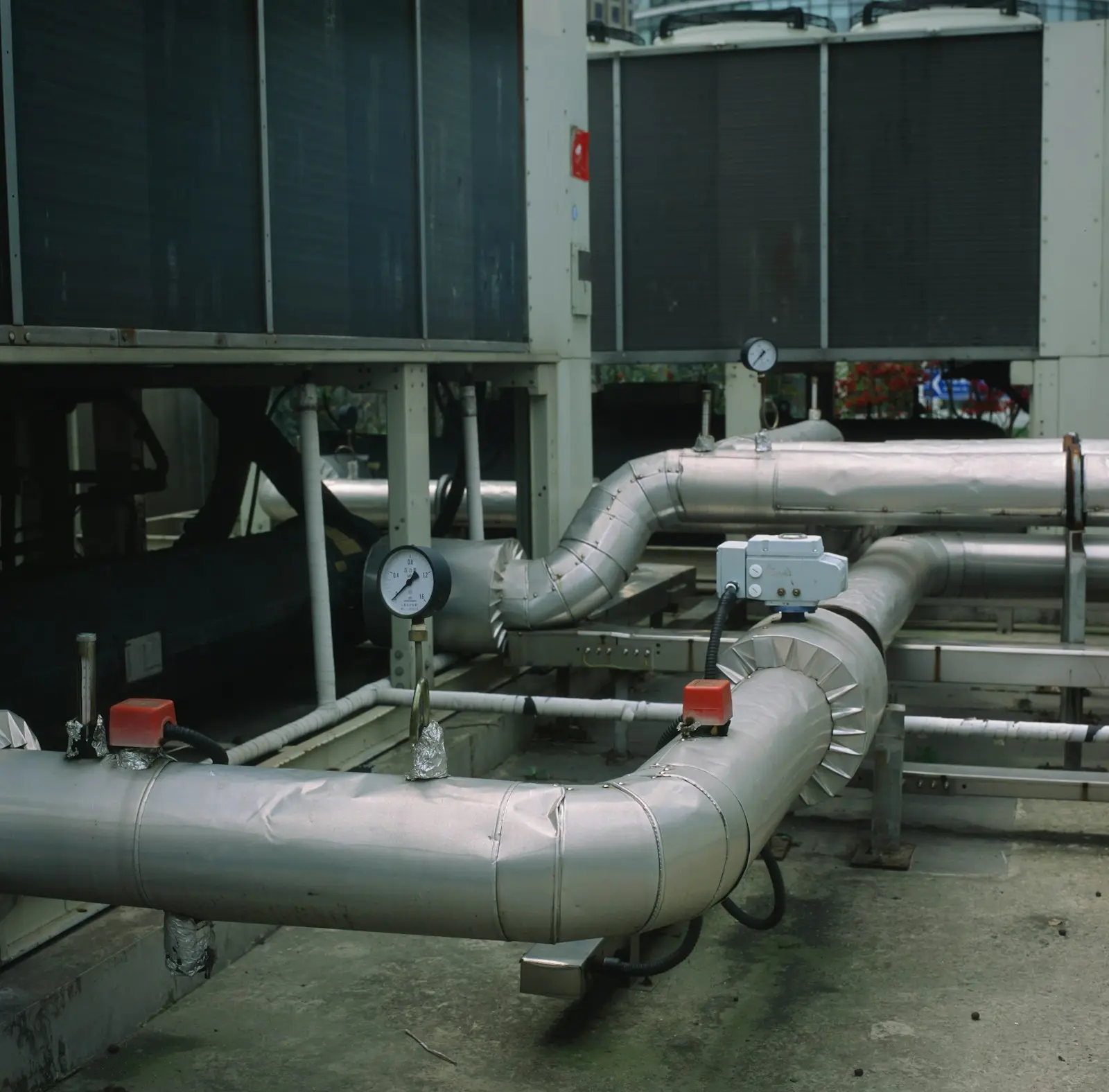 Insulated chilled-water pipework and gauges in an HVAC plant