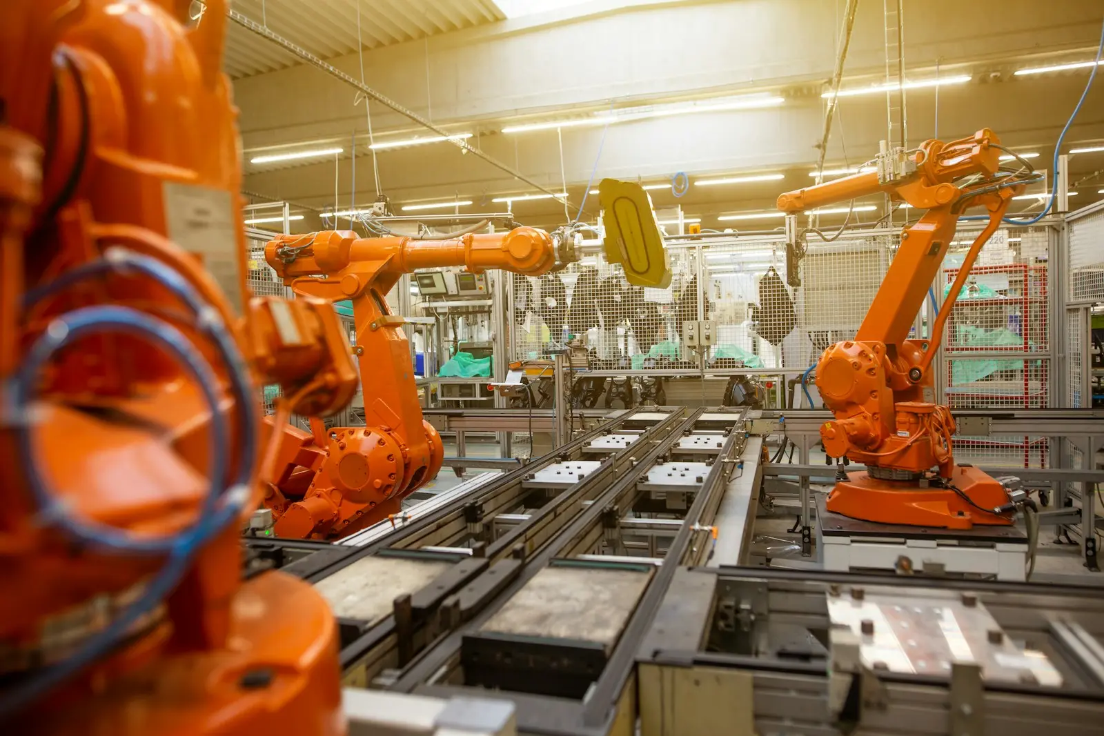 Industrial robot arms working in an automated production cell
