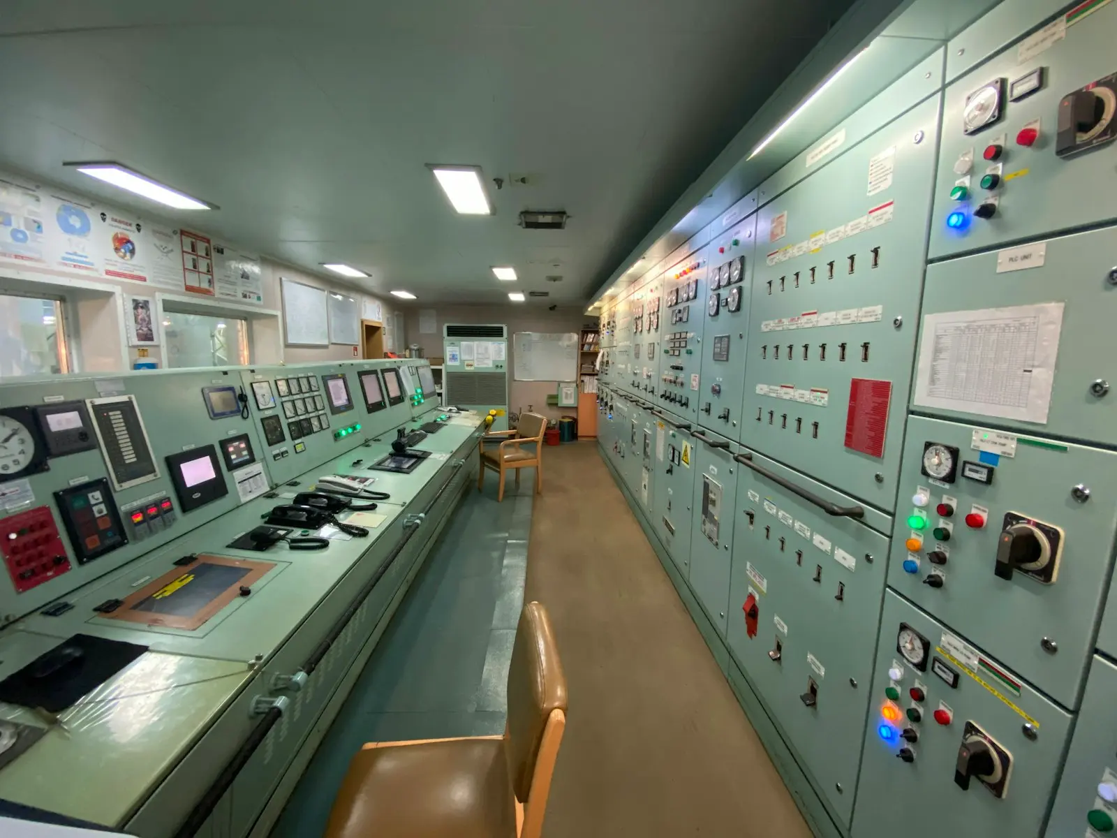 Plant control room with DCS operator consoles and control panels