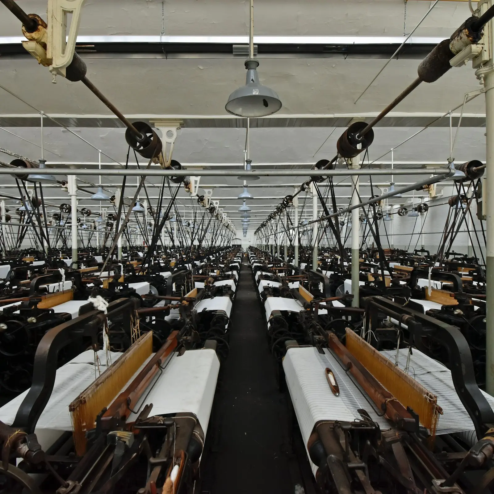 Rows of weaving looms in a textile mill